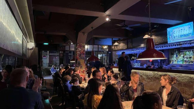 Restaurant diners eating and drinking in Darlinghurst